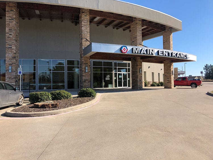 Exterior view of ER building with a large main entrance